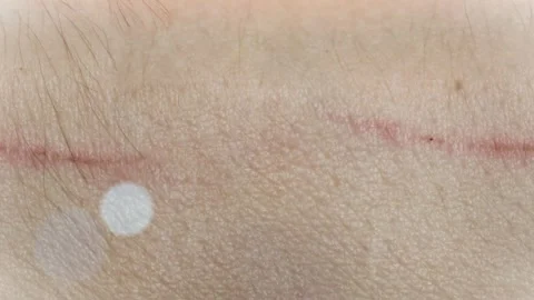 Seamless 4K looping vertical movement across natural human skin texture with a Stock Footage 344125200