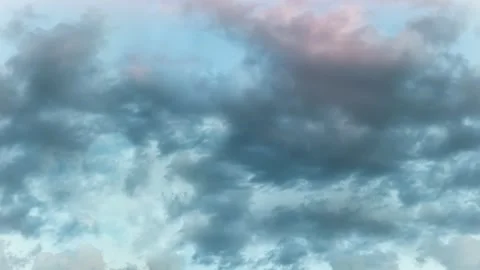 Seamless 4K looping vertical movement through dramatic blue storm clouds 動画素材 344125247