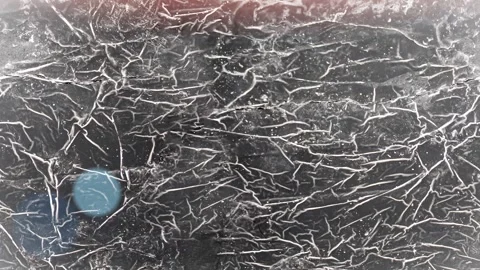 Seamless 4K looping vertical movement across a dark scratched wall texture with Stock Footage 344125391