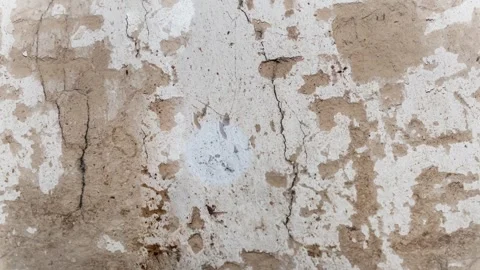Seamless 4K looping vertical movement over an aged plaster wall with peeling Stock Footage 344126375