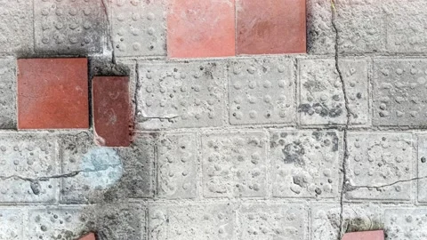 Seamless 4K looping vertical movement across a decorative wall with concrete 動画素材 344127024