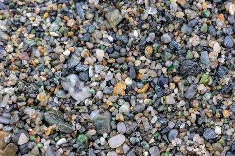 Seamless abstract background top view. Close-up texture of colorful sea pebbles Stock Photos