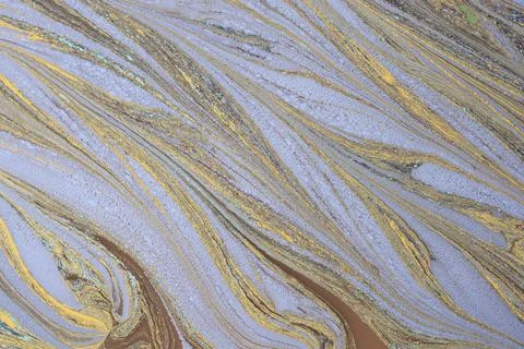 Seamless abstract texture of diagonal patterns in pastel yellow and blue Stock Photos