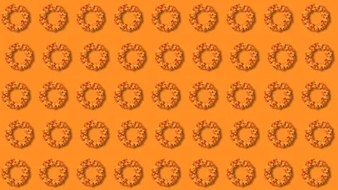 Seamless Autumn Leaf Wreath Pattern Rotating on Bright Orange Background Loo Stock Footage 343878233
