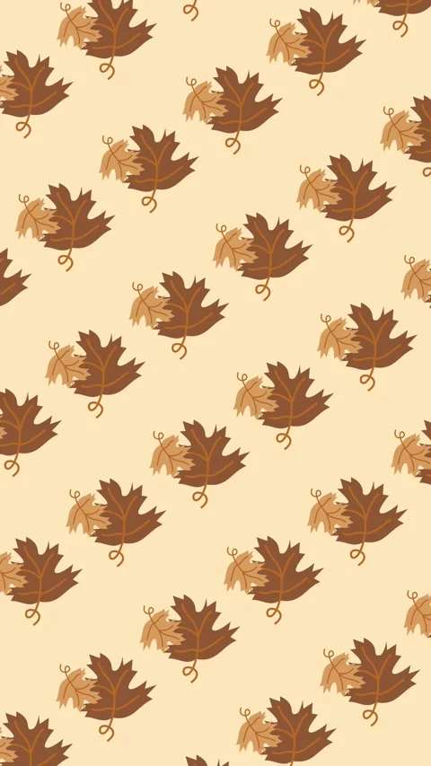 Seamless autumn pattern of brown maple leaves on warm cream background animation Stock Footage 342142361