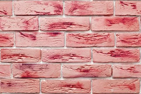 Seamless background pattern of vivid red decorative bricks on the wall surface Stock Photos
