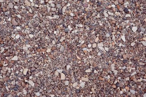 Seamless background from small stones to create endless texture Stock Photos