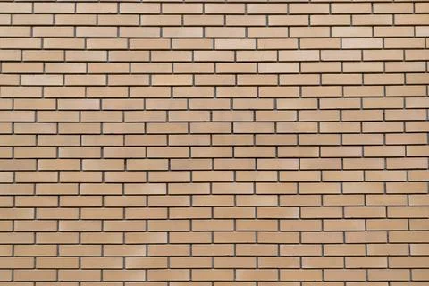 Seamless beige brick wall texture with horizontal rectangular bricks. Stock Photos