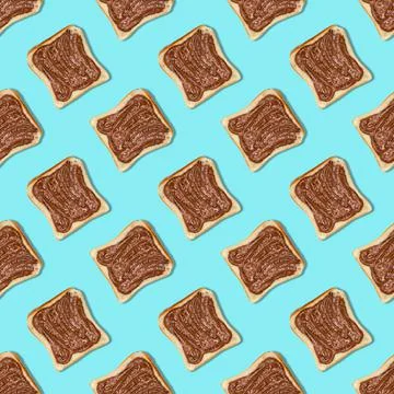 Seamless bread pattern with chocolate paste on a blue background Stock Photos