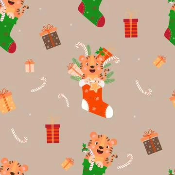 Seamless Christmas pattern with a tiger. Cute tiger cub with a gift and gingerbr イラスト素材