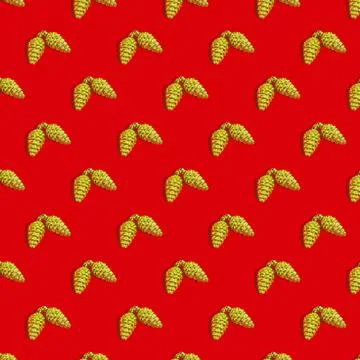 Seamless Christmas texture, golden pine cone on a red background. Sample Stock Photos