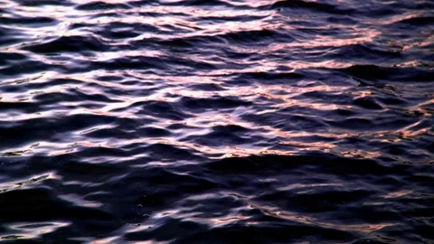 Seamless Cinemagraph Loop - Waves in water reflect light from the sunset Stock Footage 109178532