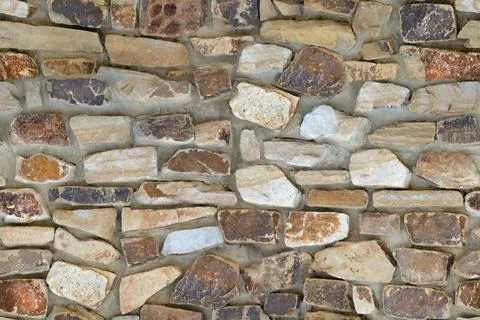 Seamless colorful pattern of stone wall texture Stock Photos