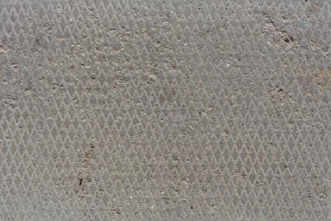 Seamless concrete texture with diamond pattern and signs of light erosion, old Stock Photos