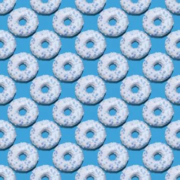 Seamless donut pattern with a shadow on a blue background 스톡 사진