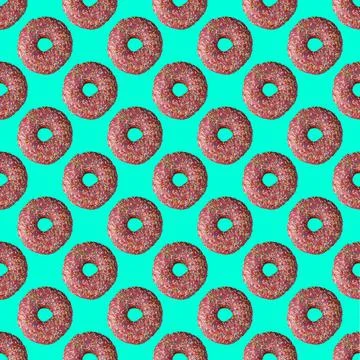 Seamless donut pattern with a shadow on a turquoise background Photos