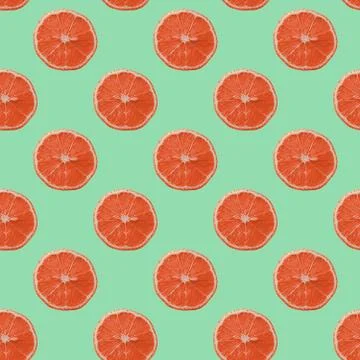 Seamless fruit pattern with citrus pieces over neo mint background. 스톡 사진