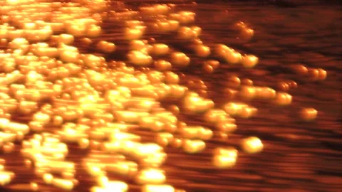 Seamless golden sunset sun light sparkling shining on flowing rippling water Stock Footage 237472401
