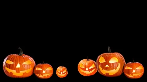 Seamless Halloween black background with glowing Jack-o'-lantern pumpkins loop Stock Footage 339314290