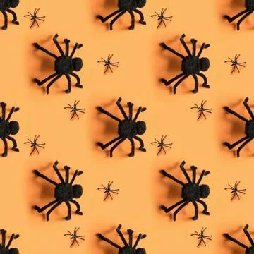 Seamless Halloween pattern of black different spiders. Stock Photos