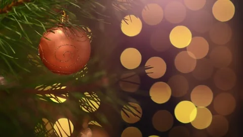 Seamless Holiday Loop of Bronze Bauble and Blinking Bokeh Lights Stock-Footage 344391350