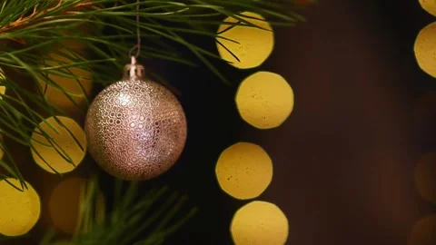 Seamless Holiday Loop with Golden Bauble and Blinking Bokeh Lights Stockbeeldmateriaal 344391512