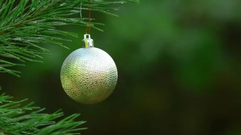 Seamless Holiday Loop with Silver Bauble and Blinking Bokeh Lights Stockbeeldmateriaal 344391407