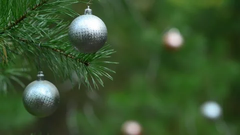 Seamless Holiday Loop with Silver Ornaments and Glowing Bokeh Stock Footage 344405205