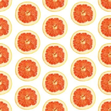 Seamless infinity pattern of isolated slices of grapefruit. Wallpaper for Foto stock