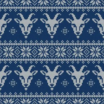Seamless knitted New Year pattern with goats and scandinavian ornament. Stock Illustration