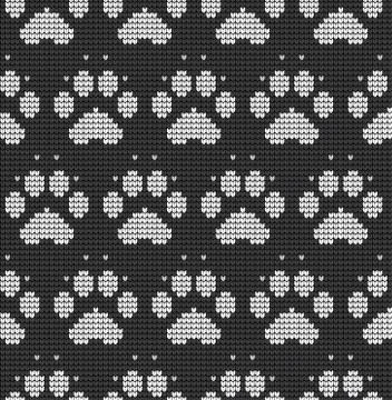 Seamless knitted pattern with cat paws knitwear pattern fabric Ilustración de archivo