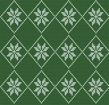 Seamless knitted pattern in nordic style with white snowflakes on green Stock Illustration