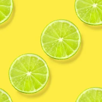 A seamless lime pattern on a vibrant yellow background, a juicy fruity citrus Stock Photos