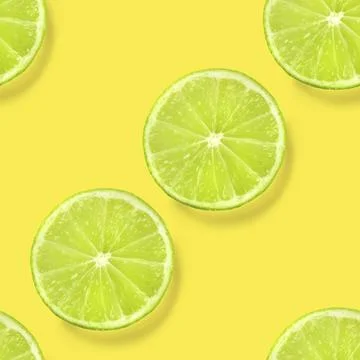 A seamless lime pattern on a vibrant yellow background, a juicy fruity citrus Stock Photos