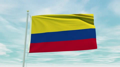 Seamless loop animation of the Colombia flag on a blue sky background. Stock Footage 211132563
