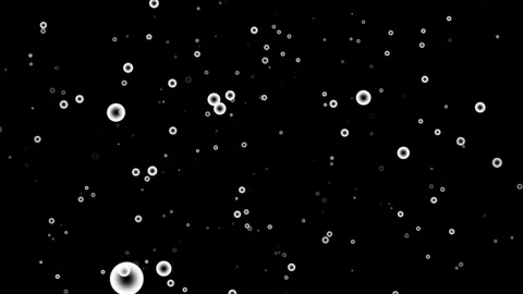 A seamless loop animation featuring white bubble floating against a black ba Stock Footage 283780007