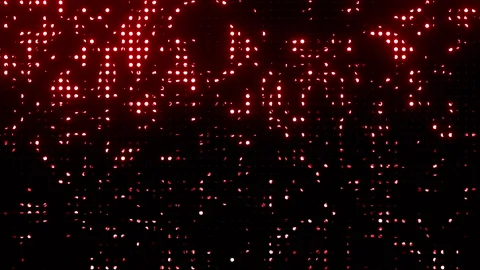 Seamless Loop Animation of Glittering Red Lights on Black Background Stock Footage 323261733