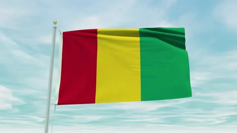 Seamless loop animation of the Guinea flag on a blue sky background. Stock Footage 211136639