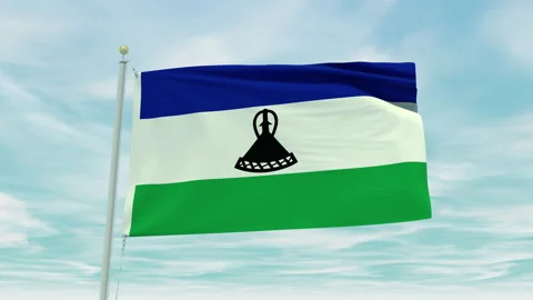 Seamless loop animation of the Lesotho flag on a blue sky background. Stock Footage 211129716