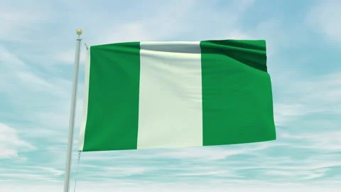 Seamless loop animation of the Nigeria flag on a blue sky background. Stock Footage 211131246