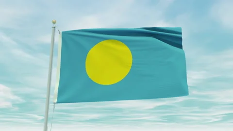 Seamless loop animation of the Palau flag on a blue sky background. Stock Footage 211138545