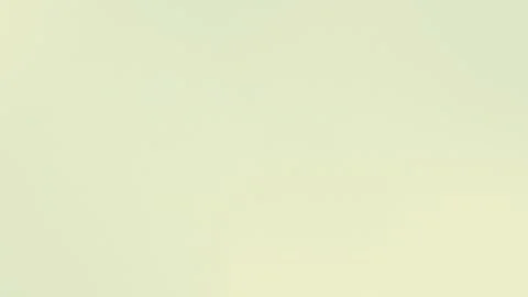 Seamless loop background in 4K with beige gradient and soft noise texture. Vídeo Stock 309700558