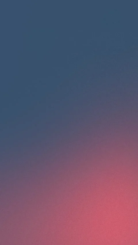 Seamless loop background in 4K with a blue to pink gradient and subtle grain Stockbeeldmateriaal 309855891