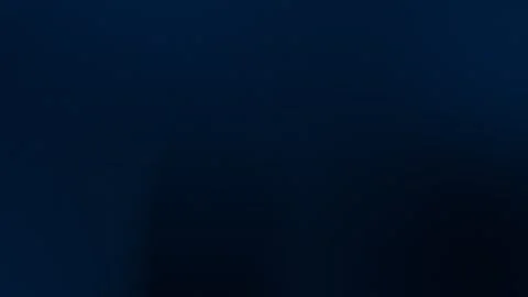 Seamless loop background. 4K dark blue gradient with soft shadow shapes and Stock Footage 299397142