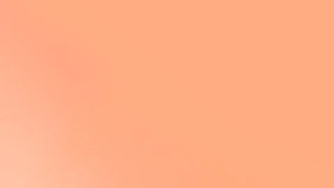 Seamless loop background in 4K, featuring a peach gradient with smooth Stockbeeldmateriaal 309058674