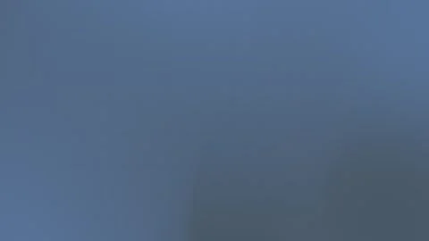 Seamless loop background in 4K featuring a textured blue gradient with subtle Vídeos de archivo 309058980