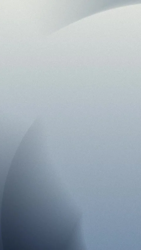 Seamless loop background in 4K featuring smooth, soft grey and blue gradients Stockbeeldmateriaal 309701325