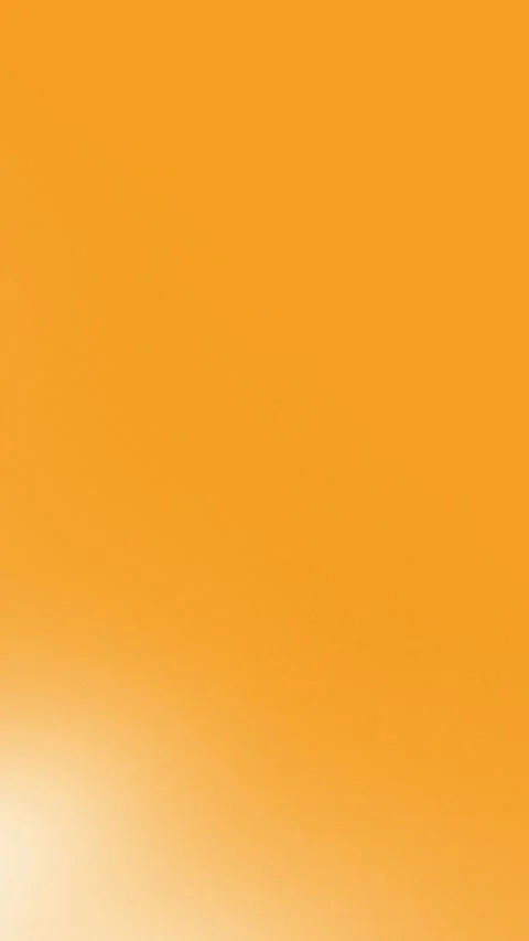 Seamless loop background in 4K, featuring a smooth orange gradient with subtle 動画素材 309956353