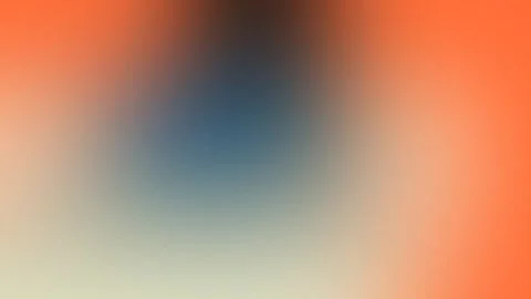 Seamless loop background in 4K with a gradient of warm orange fading into cool 動画素材 309955625