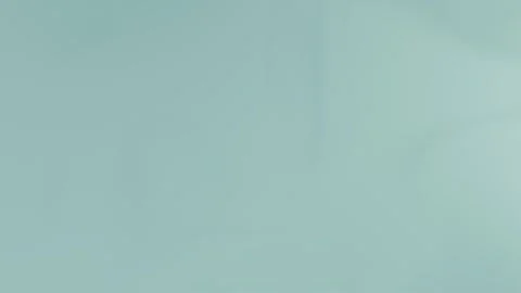 Seamless loop background in 4K showcasing a soft turquoise gradient. Light Vídeo Stock 309956863